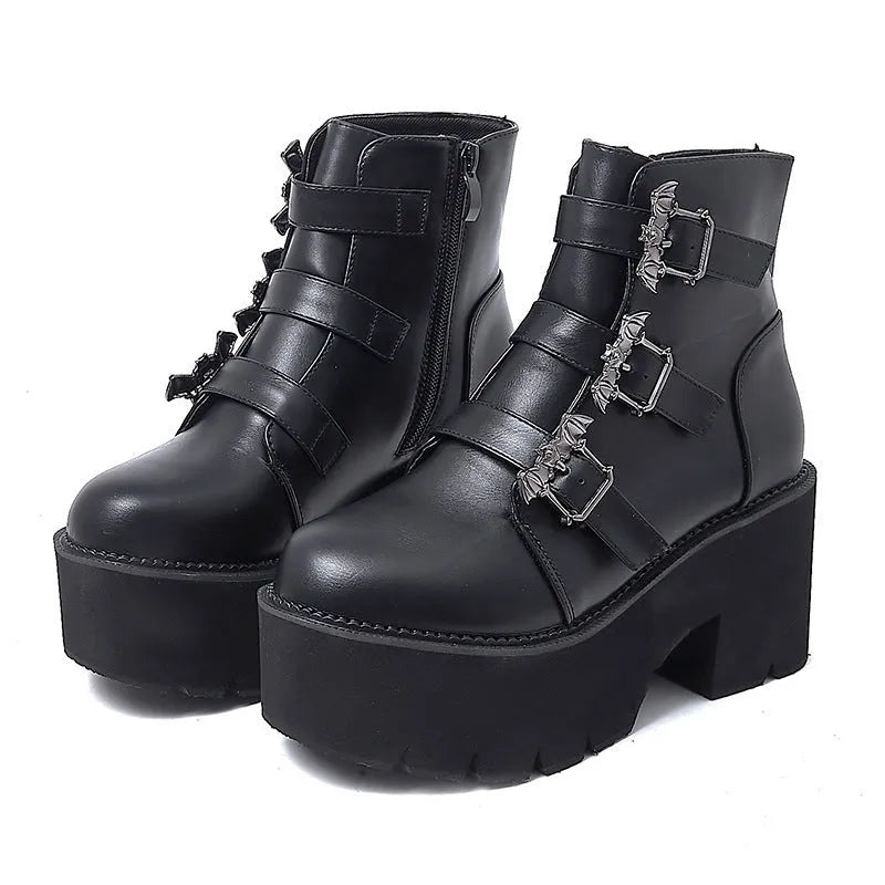Black women's punk gothic ankle boots with bat buckle, side zip, and thick heel.