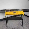 Outdoor portable metal charcoal grill with grilling grate in garden setting