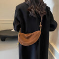 Soft PU leather crossbody underarm dumpling bag in black with sewing line detail and sandwich pocket