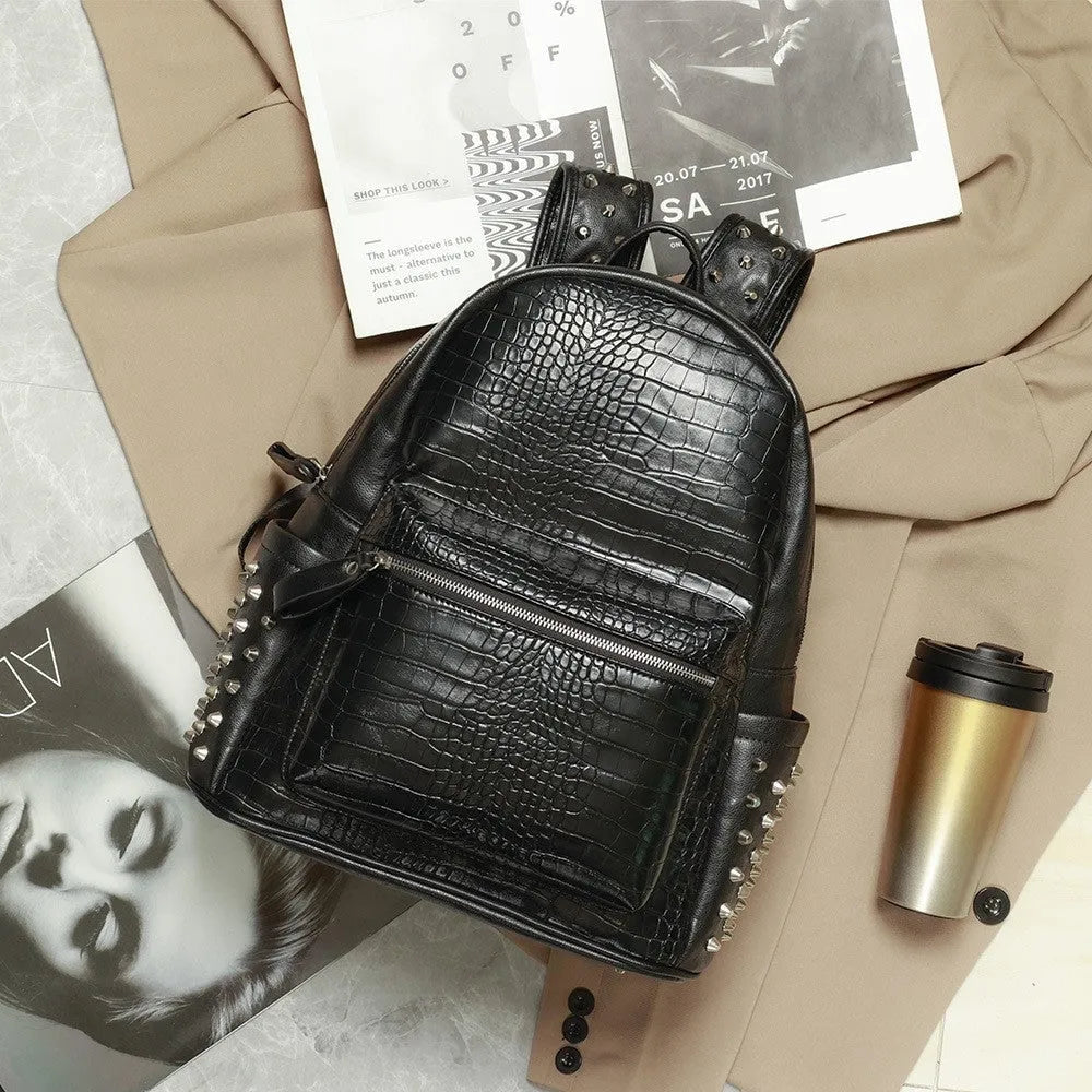Black PU leather computer schoolbag with rivets showing 55 litre capacity