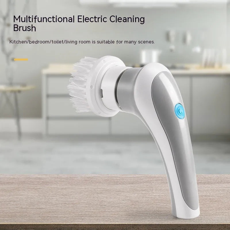 White cordless electric cleaning brush with multiple brush heads on storage bracket