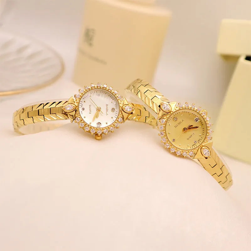 Women's vintage-style quartz watch with diamond-embossed dial and gold metal bracelet