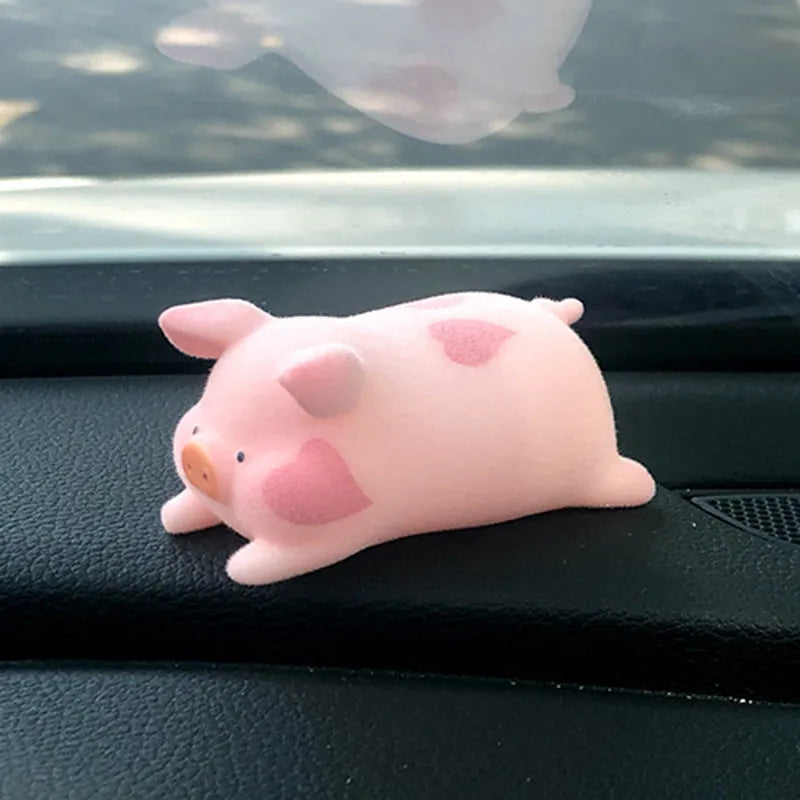 Cute resin cartoon pig figurine designed as a car dashboard decoration accessory.