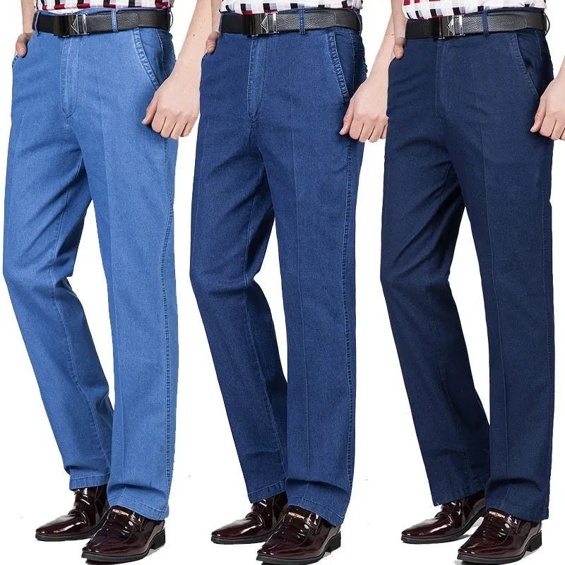 Men's loose fit high waist blue denim jeans on a plain background.