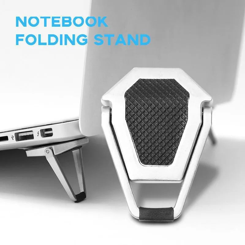 Small foldable aluminium laptop stand in silver colour next to laptop for size comparison
