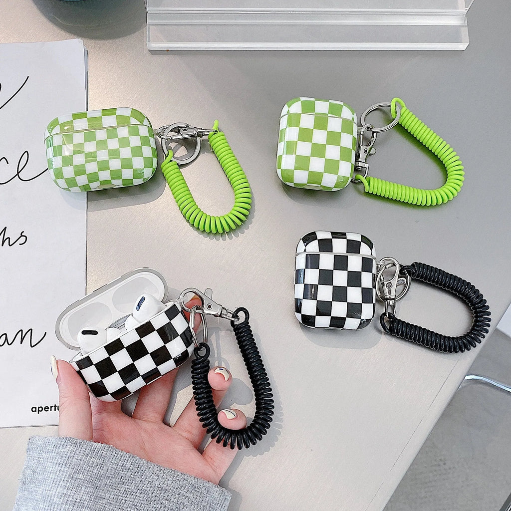 Black and green checkerboard pattern TPU protective case for Apple AirPods with pendant variations