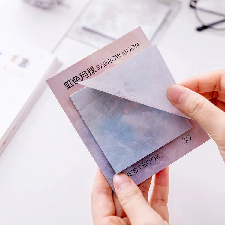Square planet-themed sticky note notepad showing oil painting designs of moon, earth, and mars.