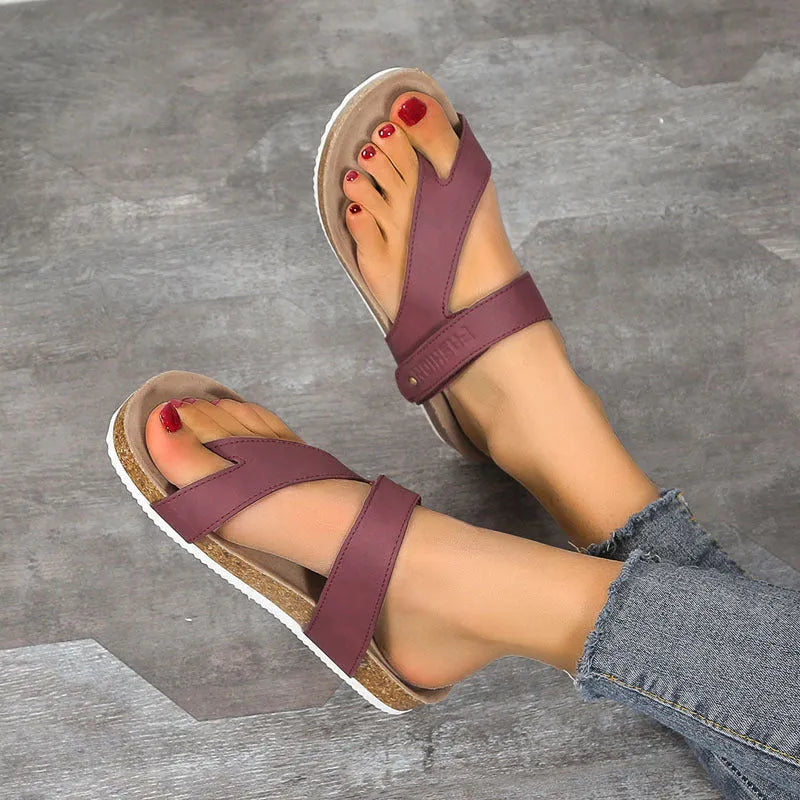 A pair of solid-colour flat toe ring flip-flops with a thick foam sole, shown in blue.