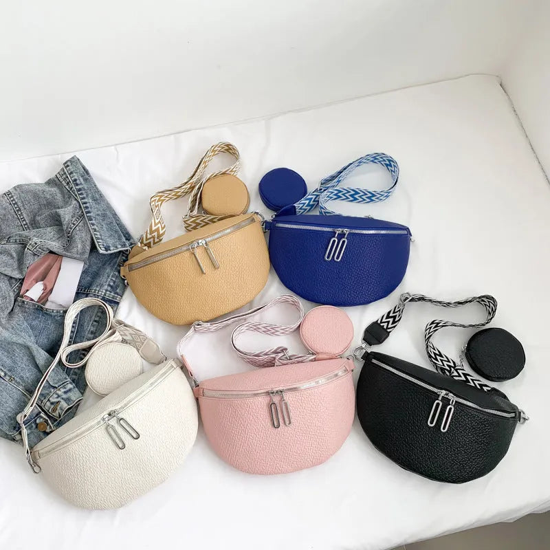 Solid colour women's crossbody bag with saddle lock zipper texture in a horizontal square clamshell shape.