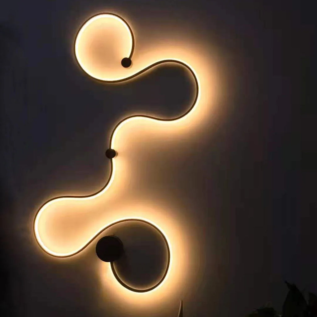 Black and white aluminium shade LED wall lamp in small, medium, large, and plus sizes