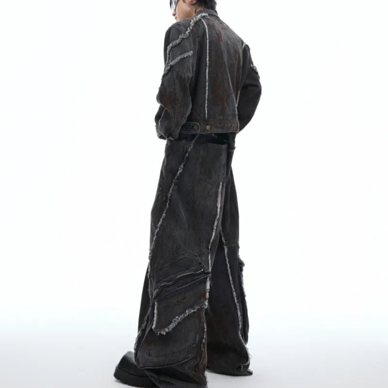 Black loose-fit denim jacket and trouser set with a splash-dye gradient pattern and padded shoulders.