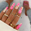 One Second Wearable Manicure press-on nails in blush colour with rose, tulip, and leopard print patterns, medium length