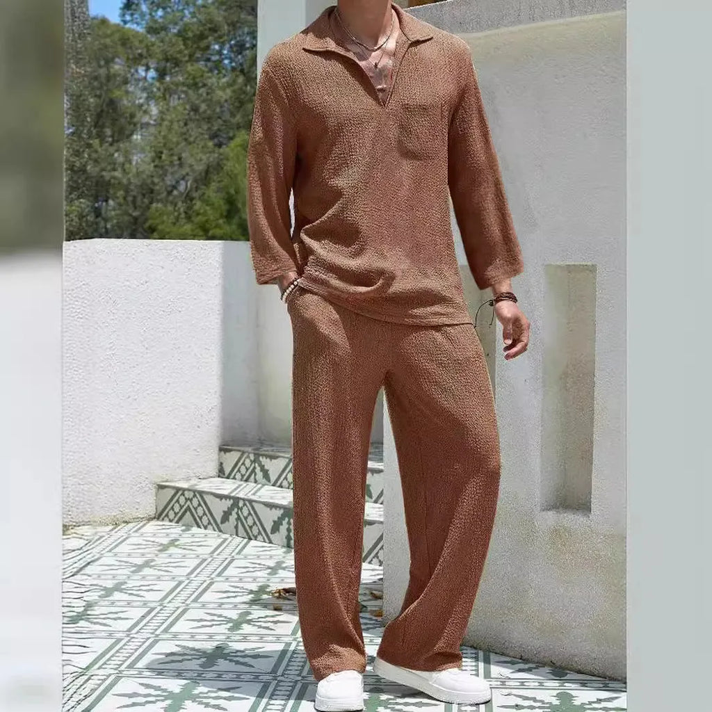 Man wearing a lake blue casual shirt and trouser suit set for autumn leisure.