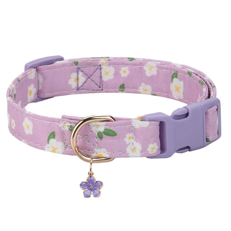 Adjustable polyester floral dog collar in Pink with buckle and slide adjuster on white background