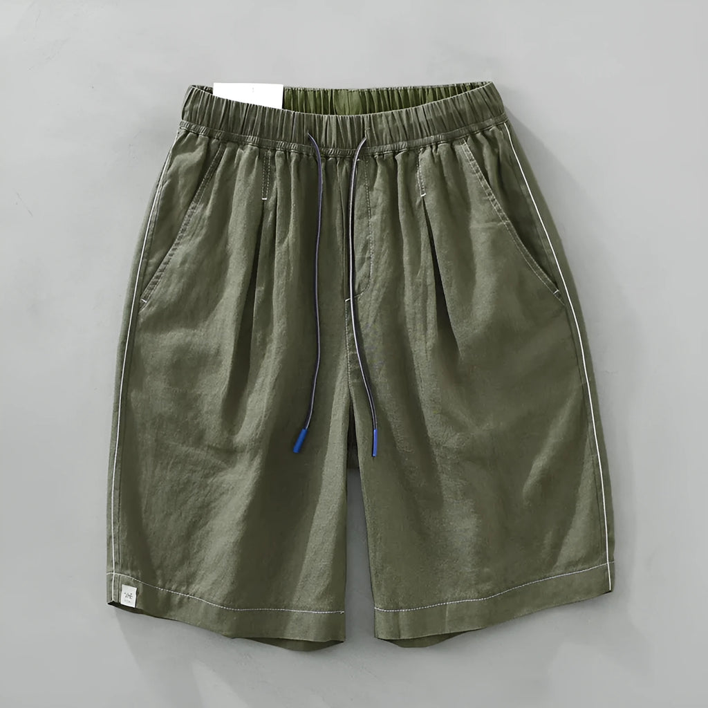 Men's green linen straight shorts with drawstring waist on hanger