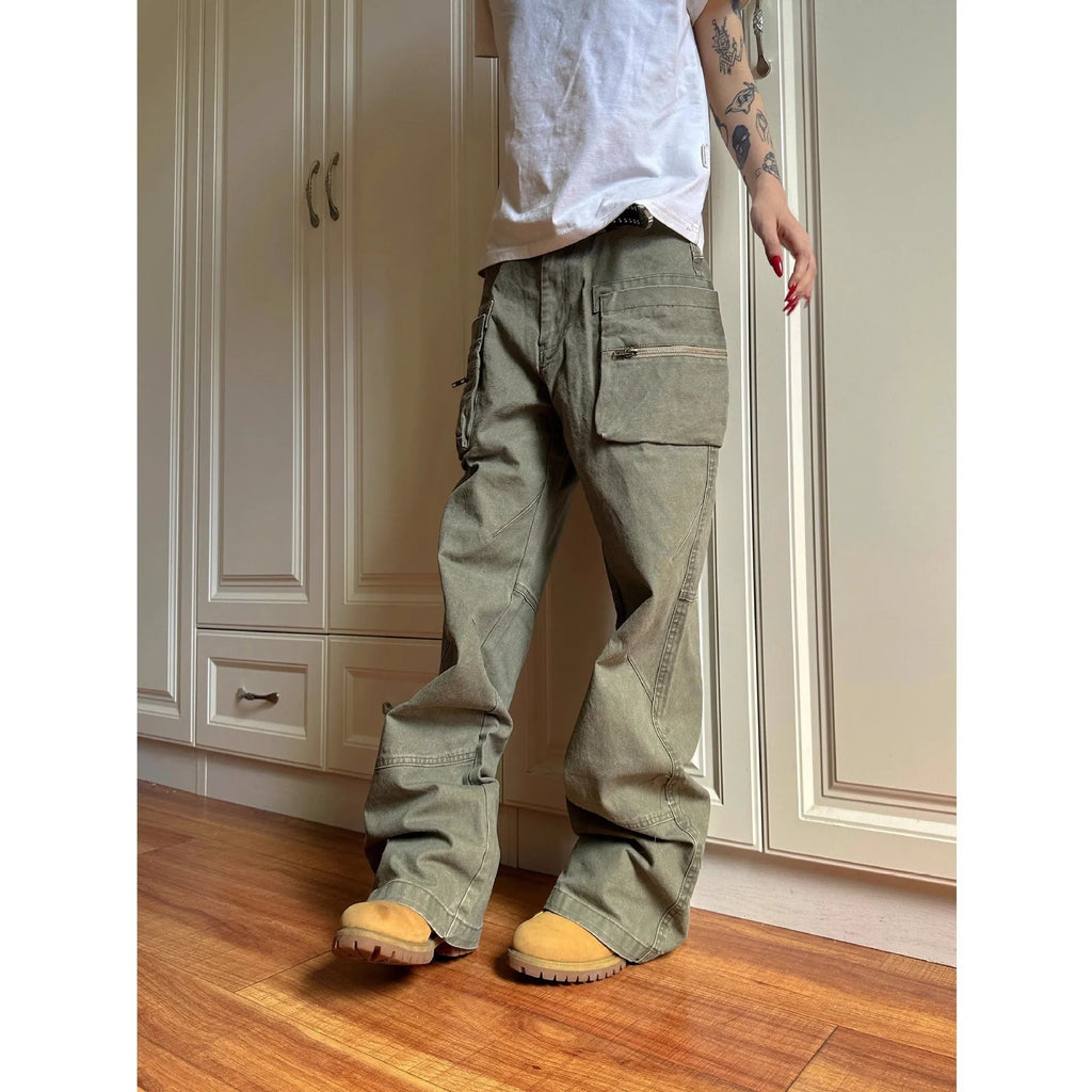 Green and black cotton casual trousers with double zipper detail and pockets on a mid-waist design.