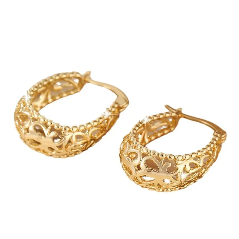 Pair of copper geometric earrings with round hollowed-out pattern in gold or silver, unisex style