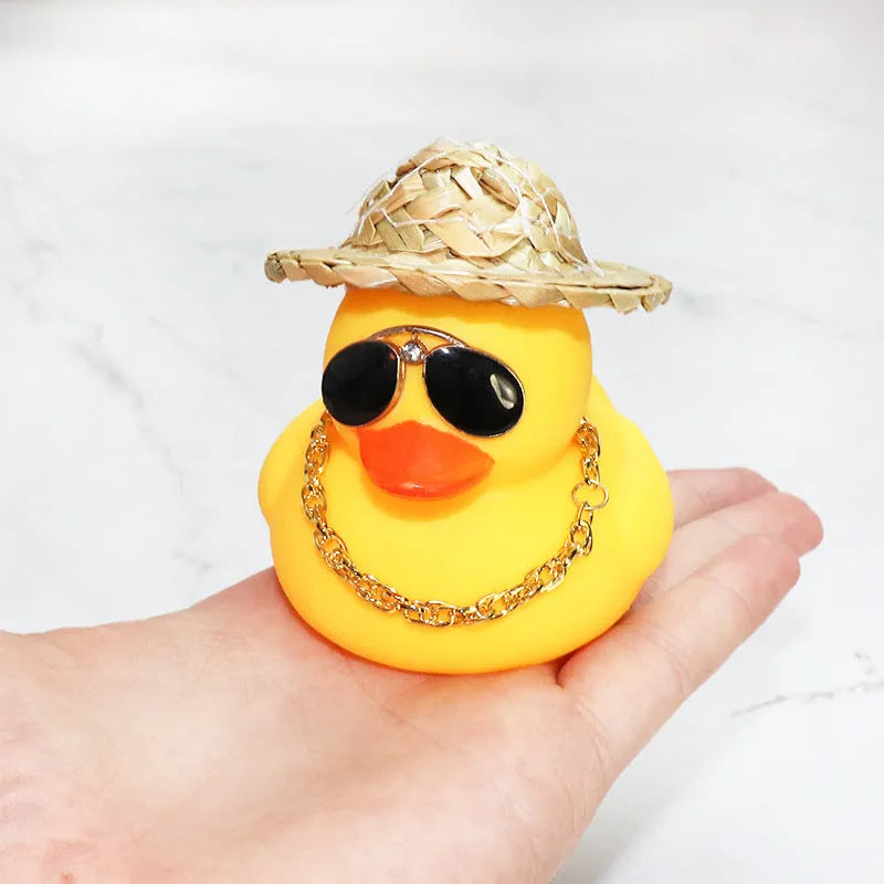 Yellow cartoon duck wearing straw hat car dashboard decoration with adhesive gel and sunglasses accessory
