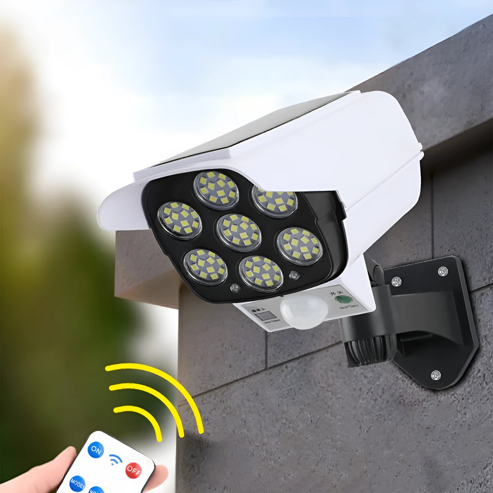 A white outdoor solar-powered security lamp with an abstraction design, mounted on a wall.