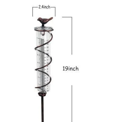 Traditional cast iron bird design outdoor rain gauge with glass measurement chamber showing 1-20 scale