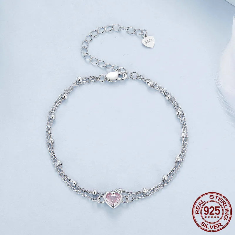 Sterling silver bracelet with heart pendant on adjustable chain