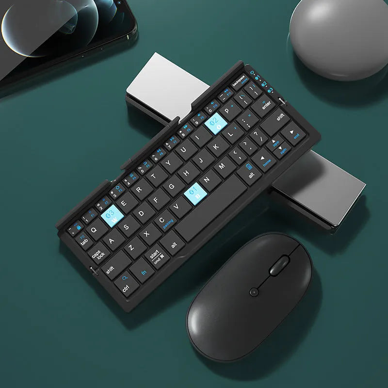 Aluminium folding Bluetooth keyboard open with phone on stand next to folded compact size