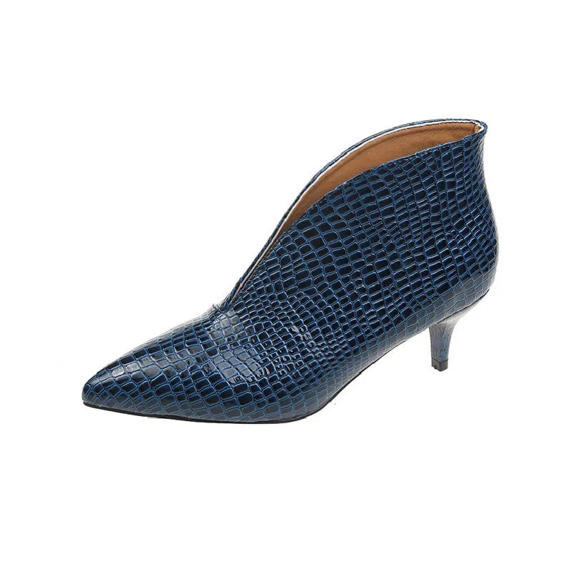Women's black ankle boots with V-cut design, embossed texture, and chunky heel