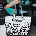 Waterproof woven handbag in PP fabric with colour-printed snakeskin pattern.
