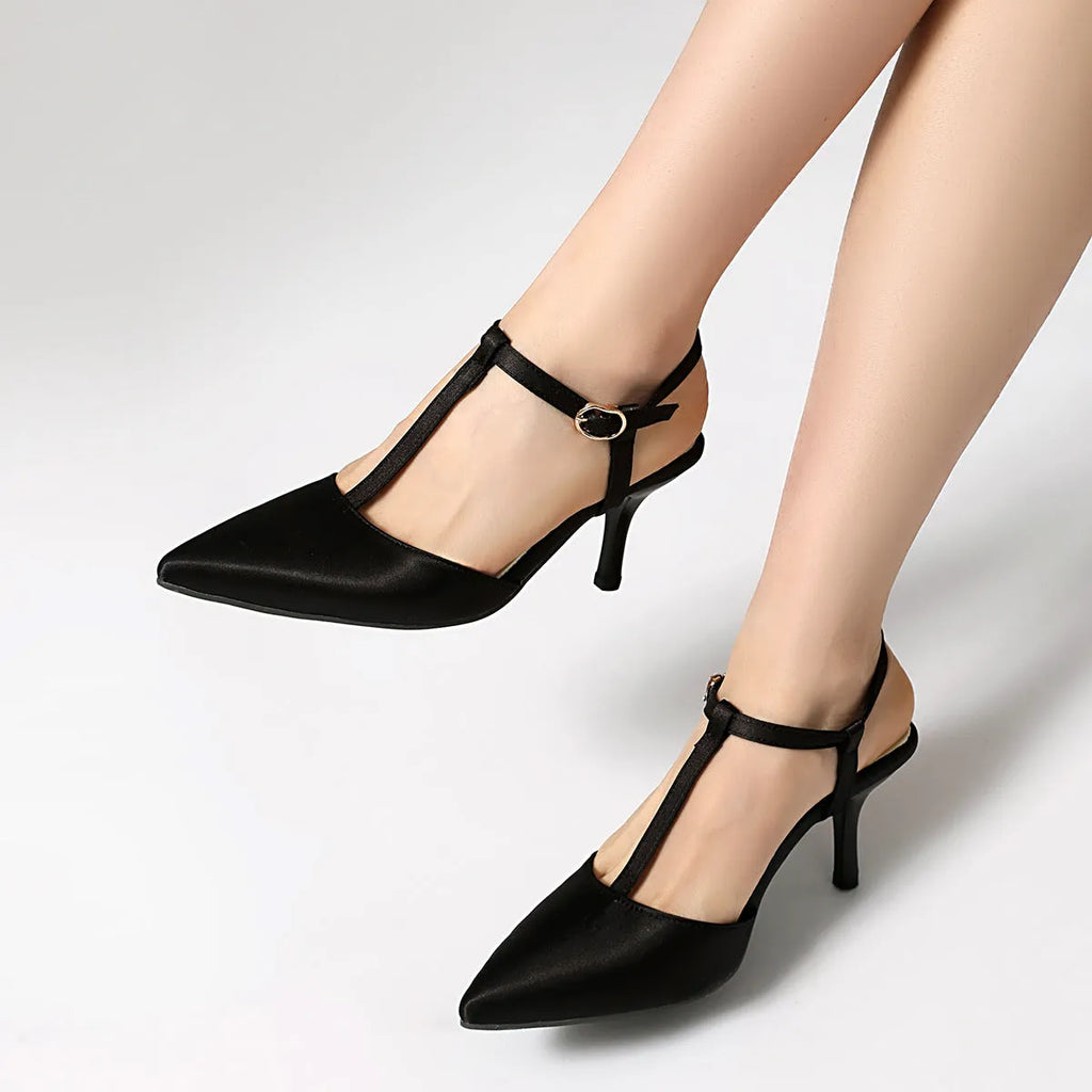 Women's pointed toe T-strap high heels in black top grain leather with unlined inner