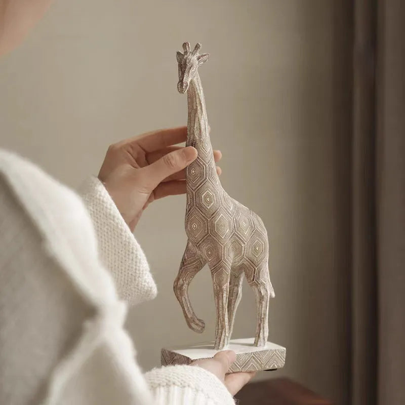 Wood colour European style synthetic resin giraffe ornament measuring 30.5cm tall.