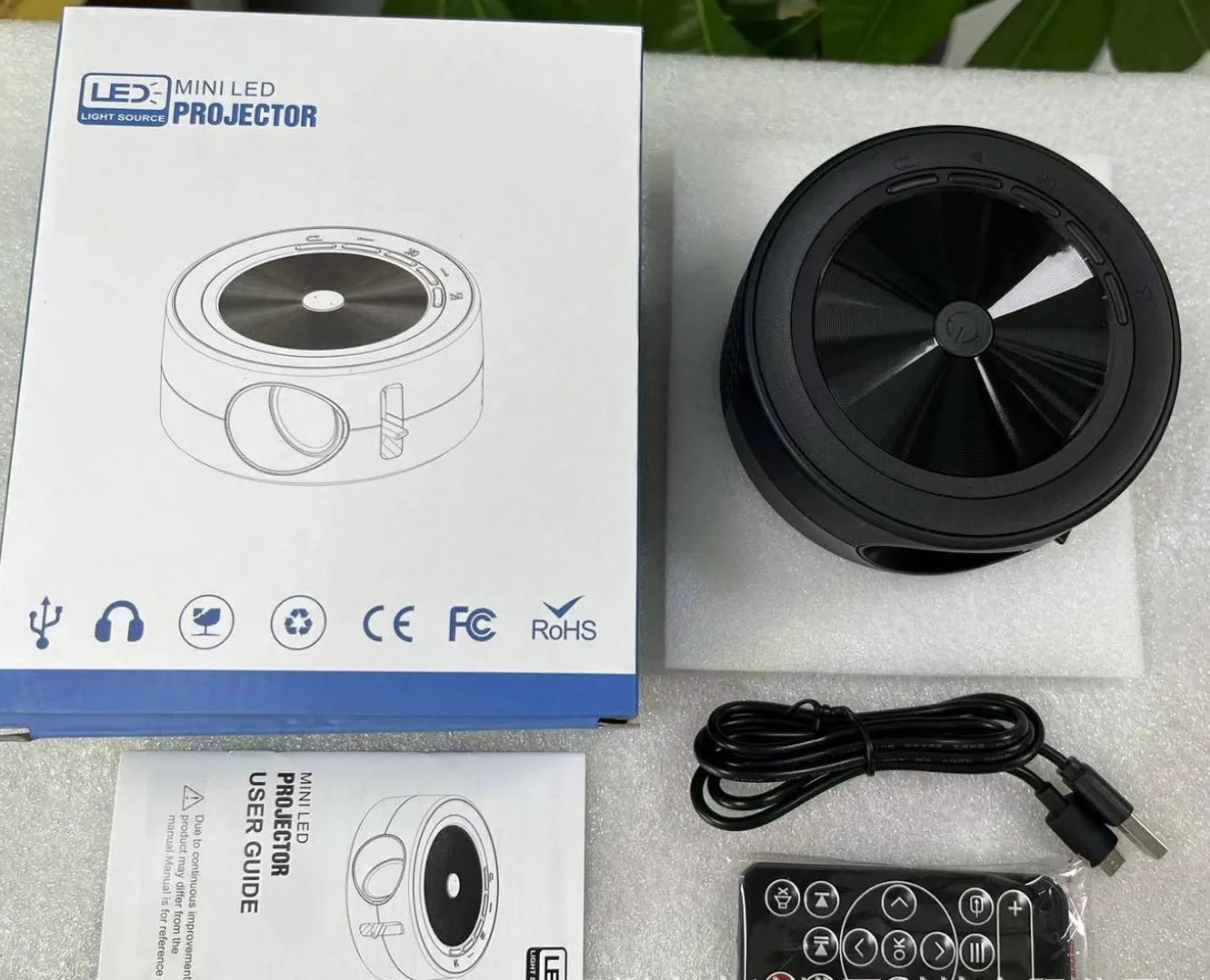 YT200 portable LED projector in black colour with compact 110x47mm dimensions