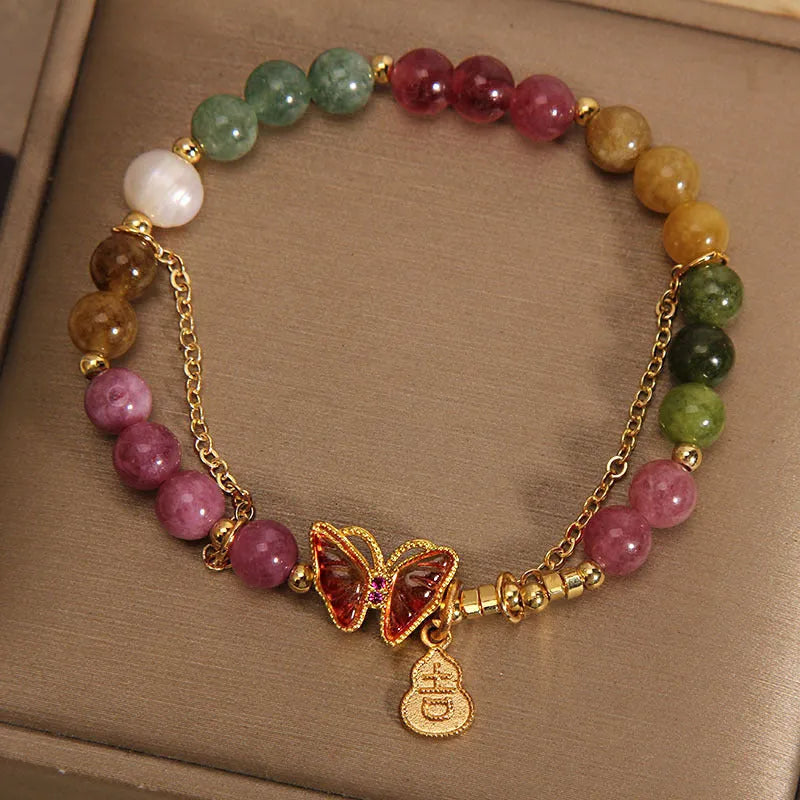 Natural jade coloured agate bracelet for women with butterfly and gourd shaped beads.