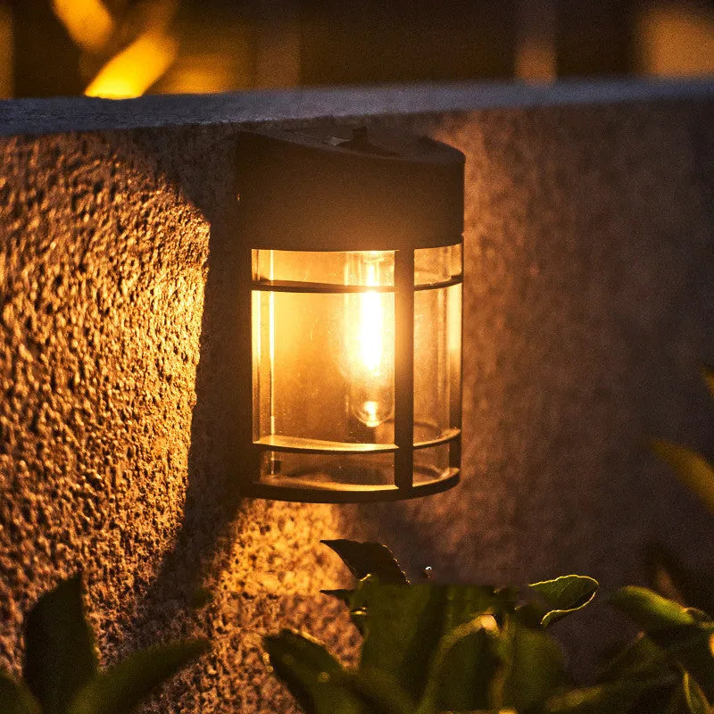Solar-powered outdoor wall light with waterproof housing and warm white illumination