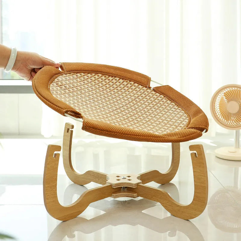 Brown woven rattan pet hammock measuring 46cm square with open weave design