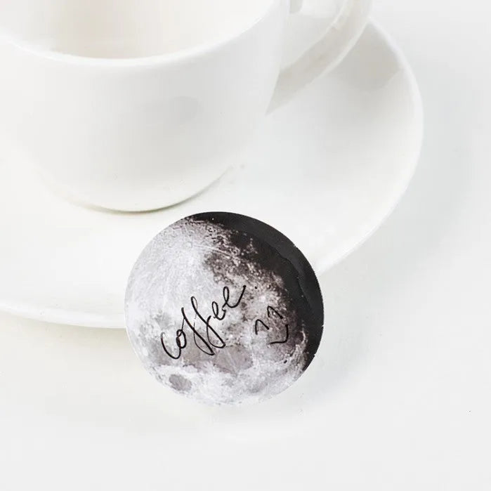 Boxed set of 45 black moon phases and calendar planet stickers for hand accounting