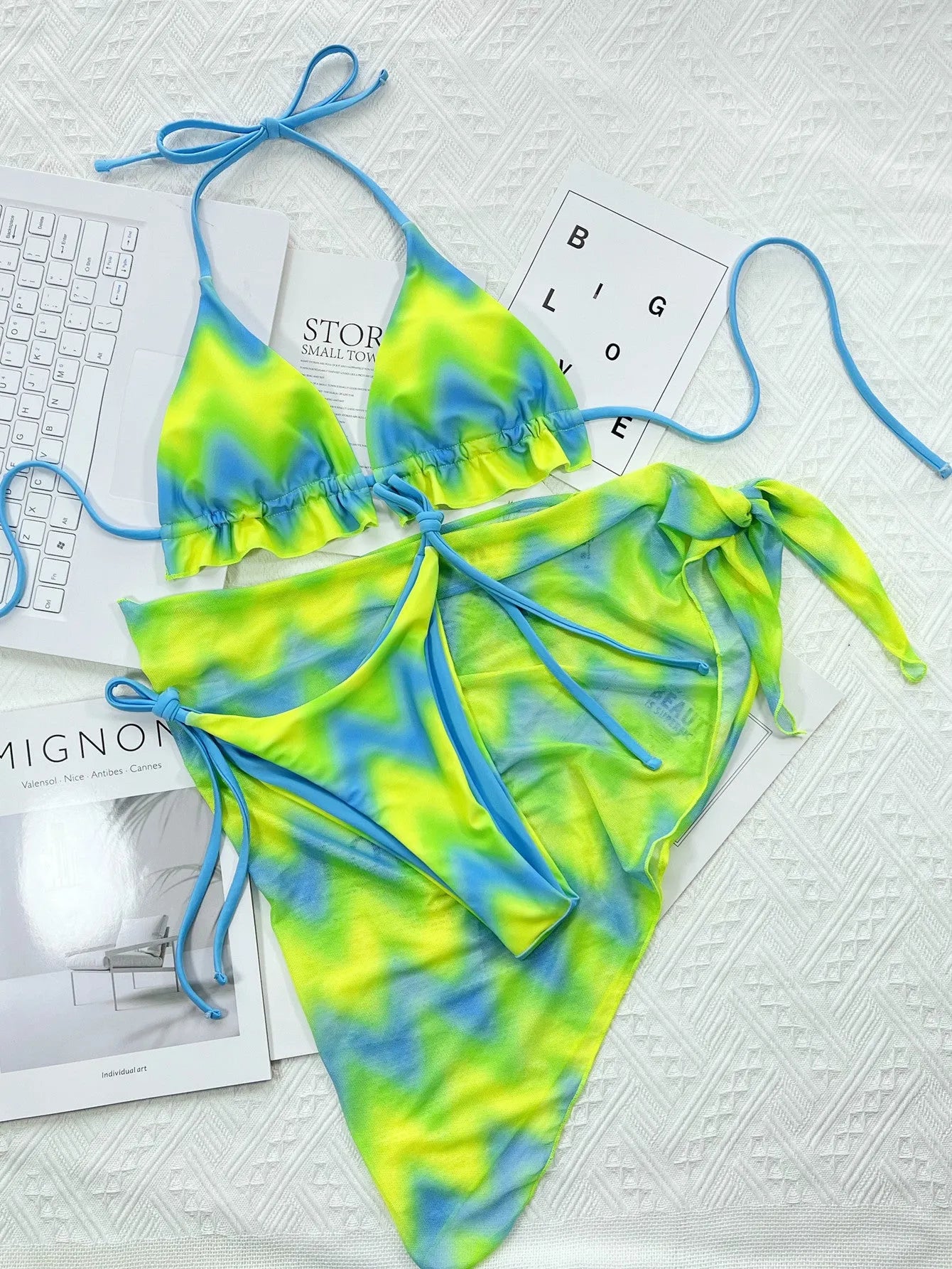 Green tie-dyed women's bikini swimsuit set with bra, pants, and skirt cover-up