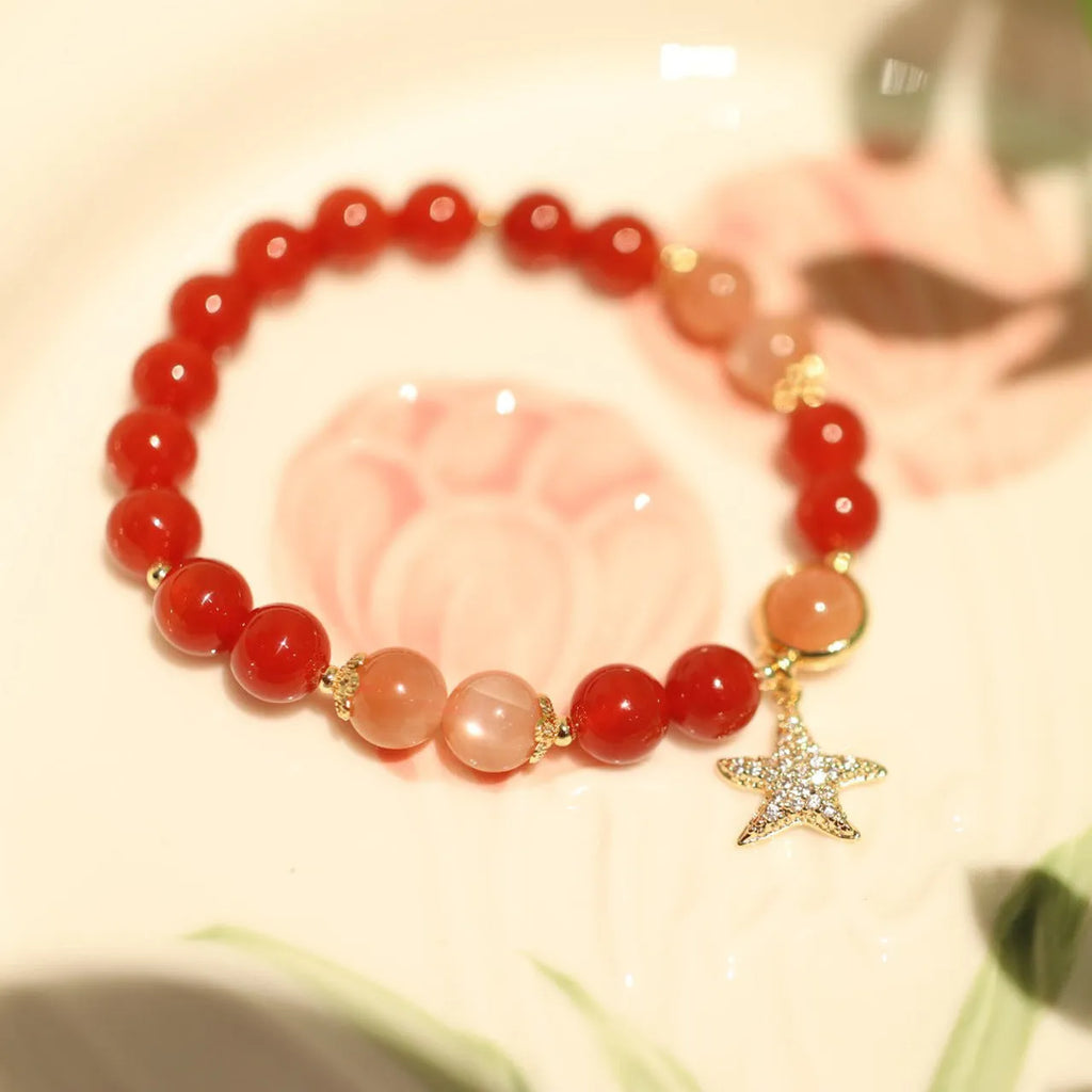 Handmade red agate and Sunstone bracelet with 8mm beads, star design, and ethnic Xiangyun patterning
