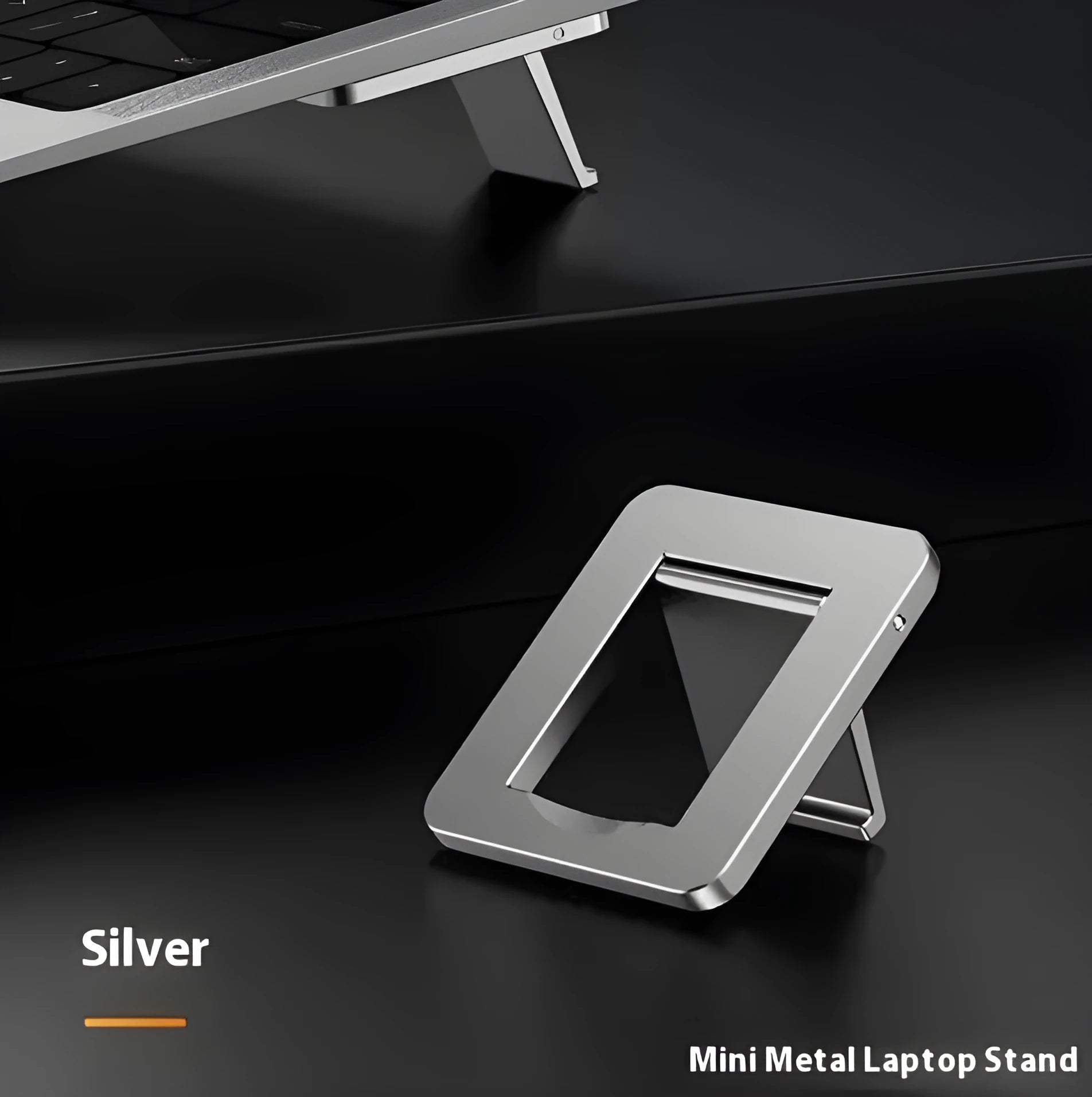 Small foldable aluminium laptop stand in silver colour next to laptop for size comparison