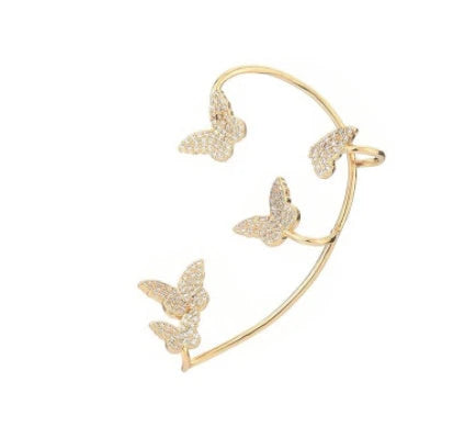 Sparkling zircon butterfly ear cuffs in gold-toned metal, featuring a delicate and elegant design for stylish accessorizing