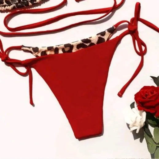 Women's leopard print halter bikini with lace-up front and split-bottom design