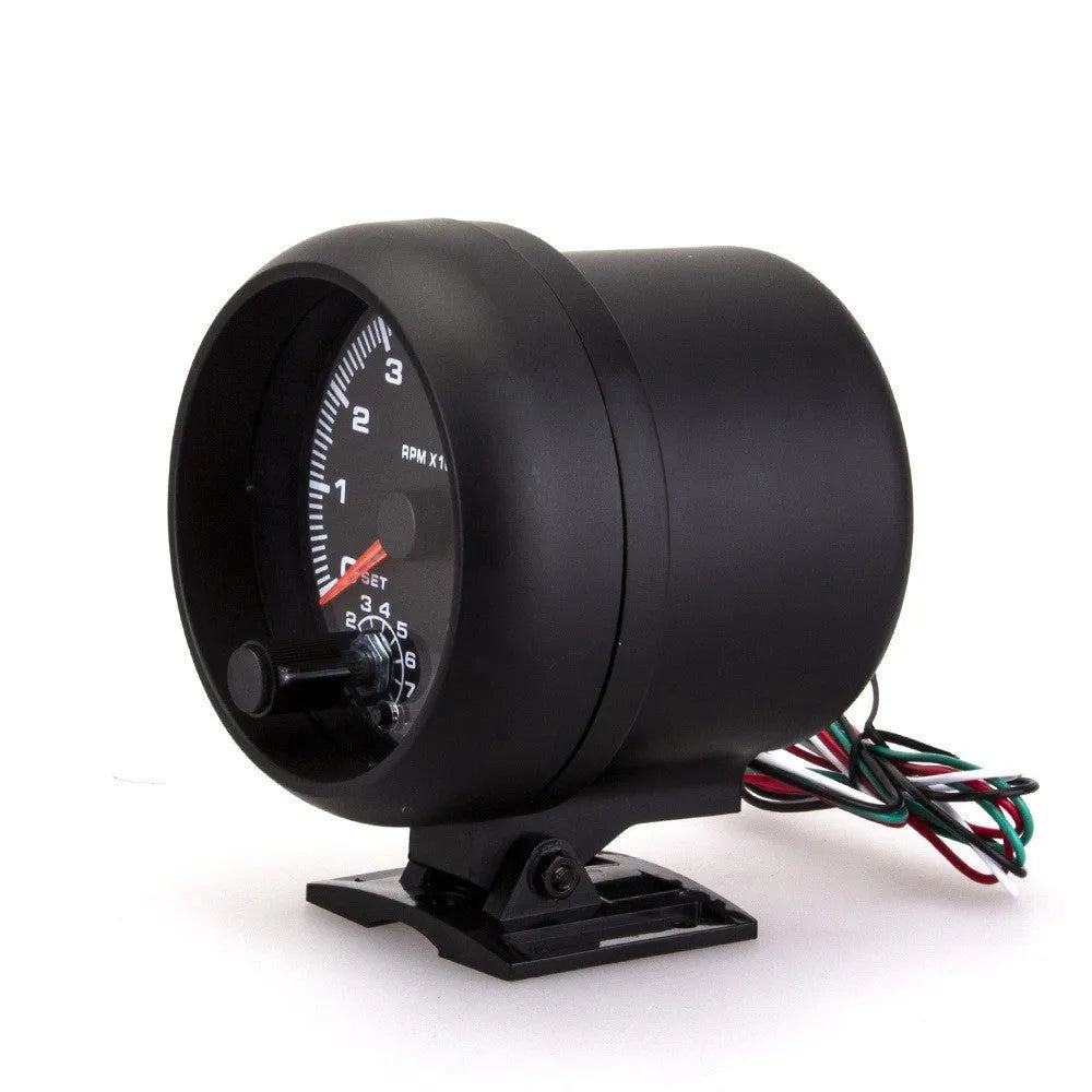 Black plastic automotive tachometer with blue light pointer display showing 0-8000 rpm range