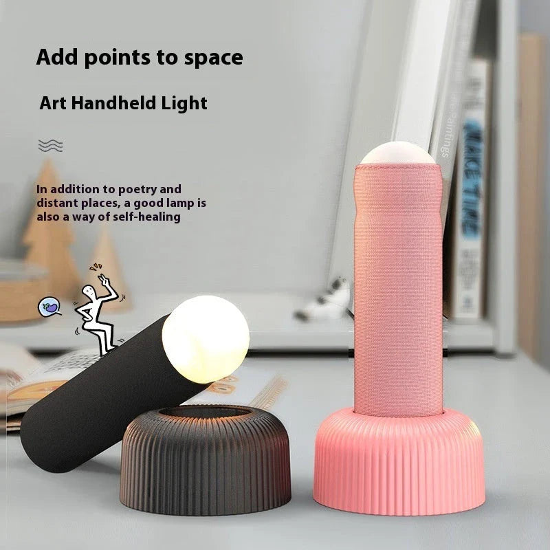 Innovative handheld LED night light with soft, fabric-like texture and soothing warm glow for a cozy, tranquil atmosphere