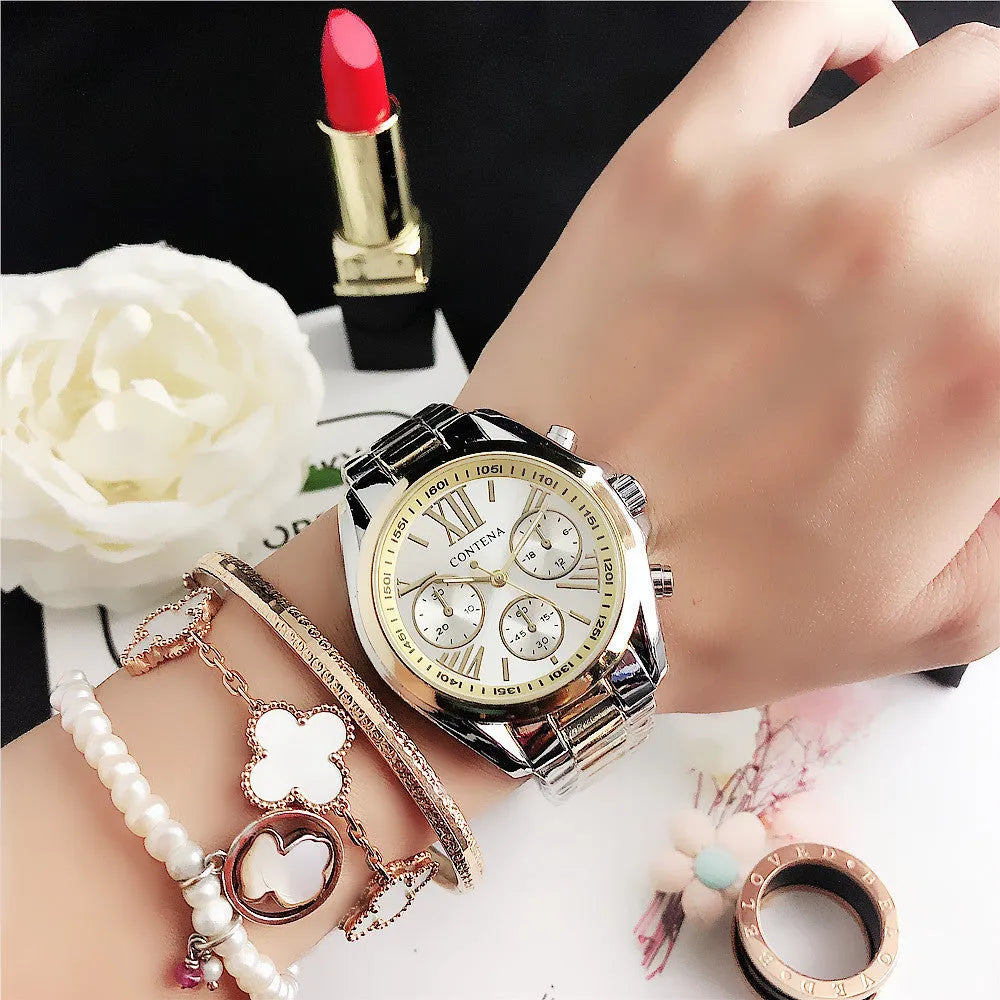 Women's silver rose gold fashion watch with mesh strap and pointer display.