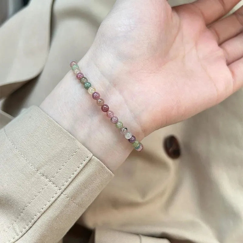 Pink crystal women's alloy bracelet with geometric electroplated charms including mermaid, lily, and cat head designs.