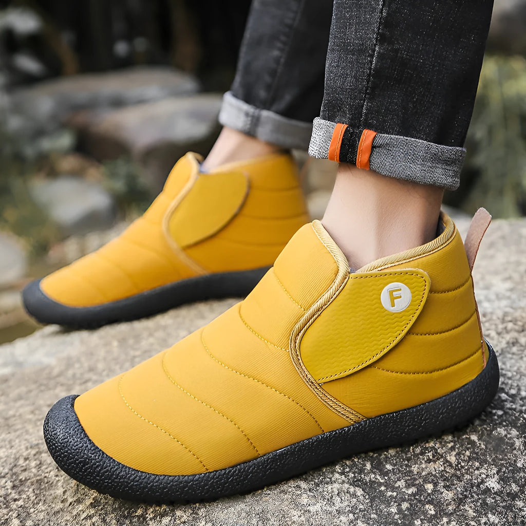 Men's waterproof cotton snow boot with non-slip rubber sole on hard ground