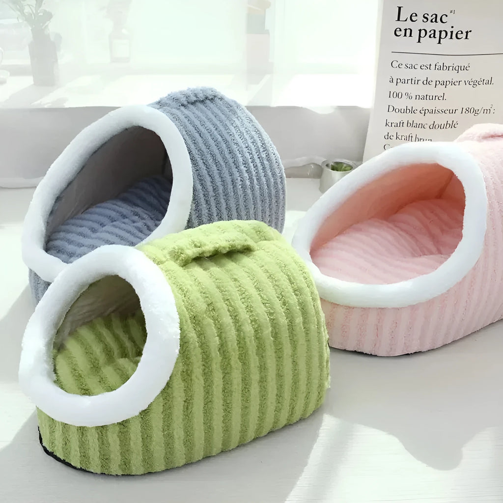 Striped thickened 3D dog bed with removable sponge mattress in blue, shown in a home setting