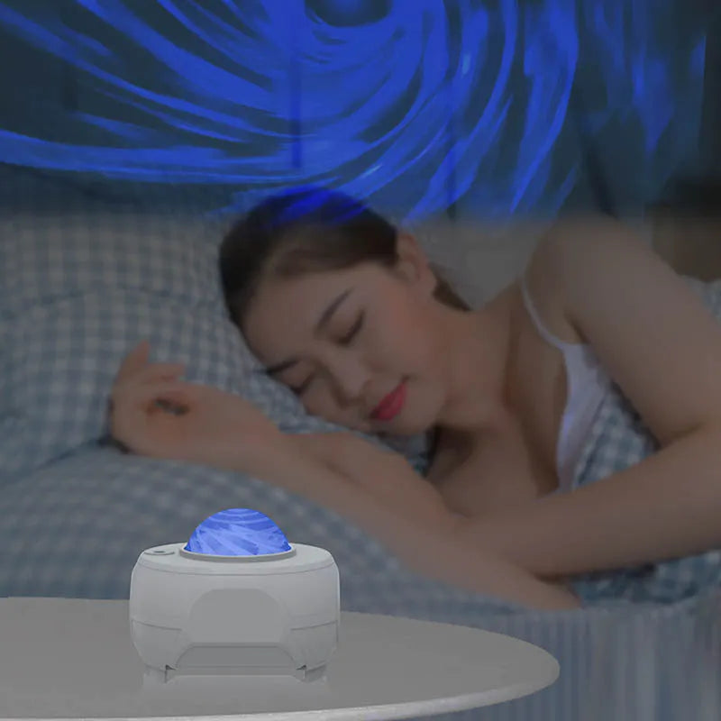 White swirl moon full star laser atmosphere lamp with remote control on a table