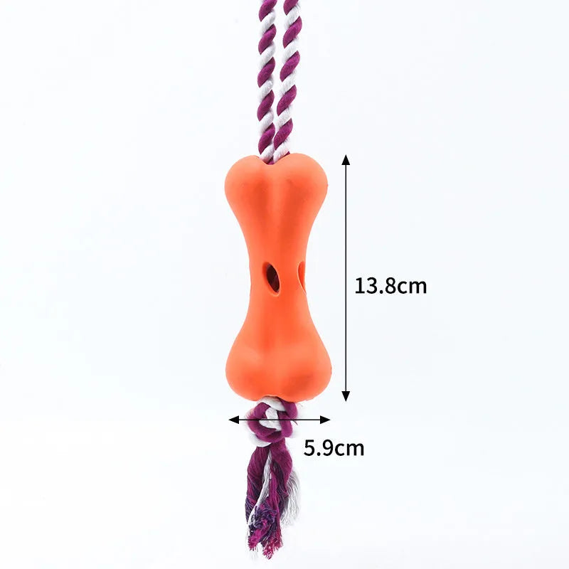 Green porous leaking bone dog toy with rope knot construction for chewing and treat stuffing