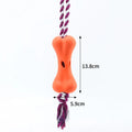 Green porous leaking bone dog toy with rope knot construction for chewing and treat stuffing