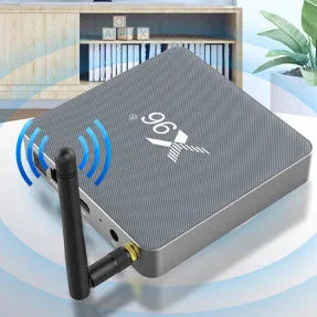 Android smart set-top box with remote control, HDMI cable, and power adapter on a table